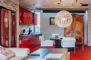 a kitchen with a chandelier and a table and chairs at Penthouse KOKO in Miyakonojō