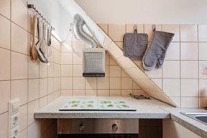 a kitchen with a counter with a chopping board on it at Ferienwohnung F Bolanz 1 in Auggen