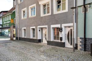 a cobblestone street in front of a building at Lilly in Meßkirch
