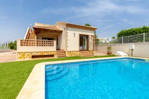 a villa with a swimming pool in front of a house at Mountain Beautiful by Fidalsa in Busot