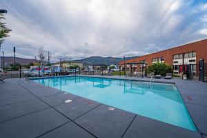 a large swimming pool in front of a building at The Cairn Hotel in Cedar City