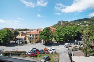 a view of a parking lot with cars parked at Appartamento Bilocale Moneglia 38 in Moneglia