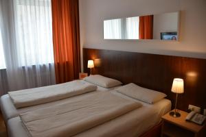 Cama ou camas em um quarto em Hotel Italia