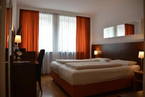 Cama ou camas em um quarto em Hotel Italia