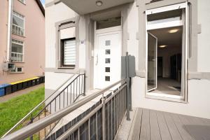 a balcony with a door leading to a yard at Lisbeth in Sankt Wendel