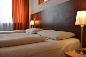 Cama ou camas em um quarto em Hotel Italia