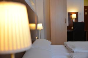 Cama ou camas em um quarto em Hotel Italia