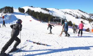 a group of people on a snow covered ski slope at Maison - Chez Louisette in Espezel