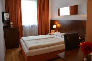 Cama ou camas em um quarto em Hotel Italia
