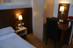 Cama ou camas em um quarto em Hotel Italia