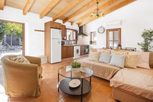 a living room with a couch and a table at Ca'n Doi in Sóller