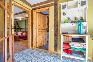 a room with a door leading into a room with a kitchen at Kleiner Eselhof in Semlow