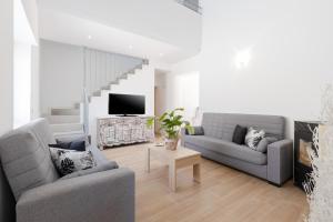 a living room with two couches and a tv at Blue Haven by Fidalsa in Catral