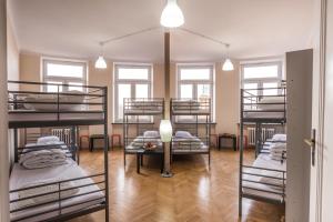 a room with four bunk beds in it at Bubble Hostel in Krakow