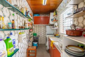 a small kitchen with a lot of dishes on the wall at Gesgroup in Lloret Blau