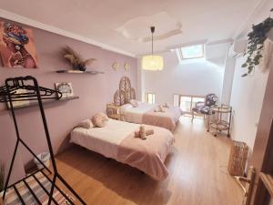 a room with two beds and a ladder in it at Oasis de Valencia in Valencia