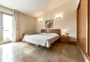 a bedroom with a bed and a large window at Villa in Amarilla Golf in San Miguel de Abona +22 photos