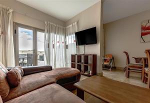 a living room with a couch and a table at Villa in Amarilla Golf in San Miguel de Abona