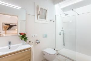 a bathroom with a shower and a toilet and a sink at Es Raco in Costitx +17 photos