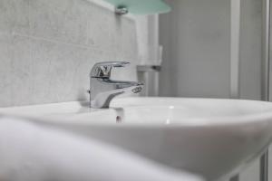 a bathroom sink with a faucet on top of it at Apartment Arnika - Mesnerhof in Sand in Taufers +12 photos