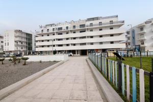 a sidewalk in front of a large building at Ria Formosa Pool Heaven in Olhão