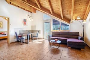 a living room with a couch and a table at Obstgut Mit Herz Thomas Maier in Stockach