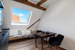 a room with a table and chairs and a window at Erlebnis-Bauernhof Scheunenglück in Oberkirch