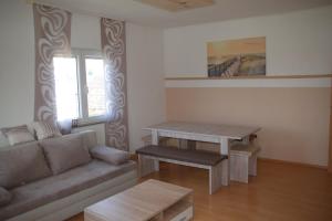 a living room with a couch and a table at Stylische Wohnung in Fellbach in Fellbach