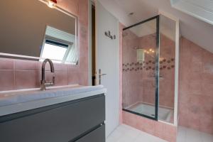 a bathroom with a sink and a shower at Maison entre terre et mer in Pluvigner +13 photos