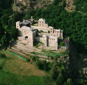 a large castle on a hill with at Nel Cuore della Via Francigena in Aosta