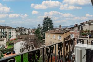 a view of a city from a balcony at Chica's Lucca Luxury Loft in Lucca