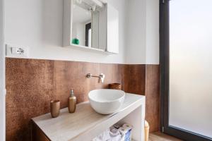 a bathroom with a white bowl sink on a counter at Cinque terre - Laspezia - Loft 1910 in La Spezia +27 photos