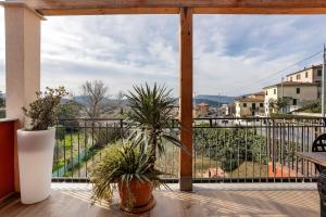 a balcony with a view of a city at Cinque terre - Laspezia - Loft 1910 in La Spezia