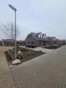 a street light in front of a house at Emily in Geeste