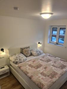 a bedroom with a bed with pillows on it at Emily in Geeste +2 photos