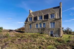 an old stone house on top of a hill at Studio vue sur mer in Plomodiern +17 photos