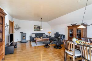 a living room with a couch and a table at Vista-Homert in Eslohe