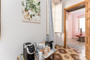 a coffee machine sitting on a table in a room at Gustalu in Dorgali +34 photos