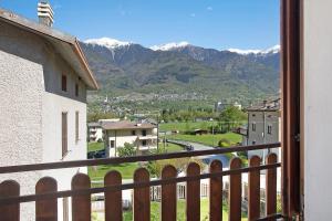 a view from a balcony of a town with mountains at In Valtellina da Valter e Lella in Colorina