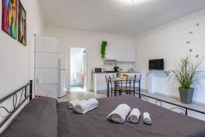 a room with a table with two slippers on it at Villa Tosca dell'Angelo con piscina in Comiso