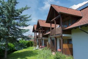 an exterior view of a house with a yard at Ferienhaus Behler in Kressbronn am Bodensee