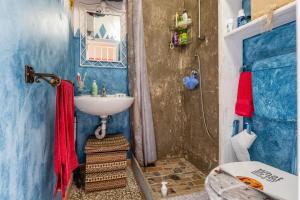 a small bathroom with a sink and a toilet at Tipica casa a San Pantaleo in San Pantaleo +15 photos