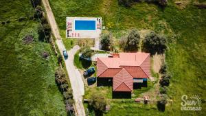 an aerial view of a house with a red roof at Villa Malamuri in Budoni