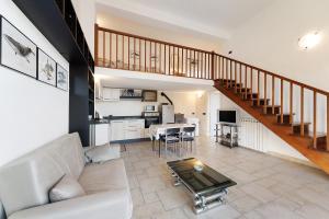 a living room with a couch and a table at Casa Max in Levanto