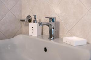 a bathroom sink with a faucet on top of it at Casa Max in Levanto