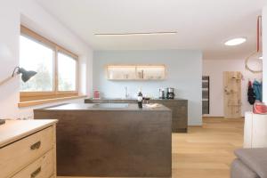 a kitchen with a sink and a counter top at Ferienwohnung Berg Wieserhof in Aldino +16 photos