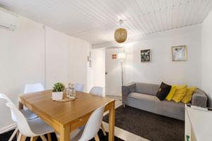 a living room with a table and a couch at Prestigegoldresidence 1 - Old Town in Guimarães