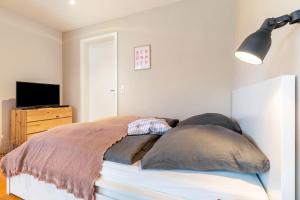 a bedroom with a bed with two pillows on it at Fewo Kleines Glück in Friesenheim
