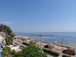 a view of a beach with people and the ocean at Appartamento A - Le Terrazze in Ribera +20 photos