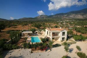 an aerial view of a house with a swimming pool at Villa Linatela Ideales Resort in Kefallonia